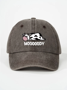 Close-up of MOOOOODY cartoon cow embroidery on washed cotton vintage baseball cap