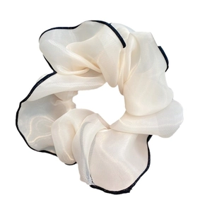 Elegant white chiffon oversized scrunchie with black contrasting trim for hair styling