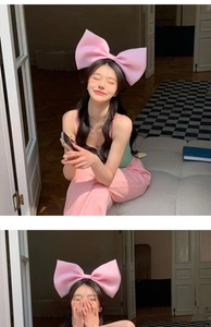 Detail of a large pink bow headband for women showing high-quality fabric and soft 3D design