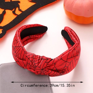 Detail of red Halloween headband with black spider web pattern and 39cm circumference
