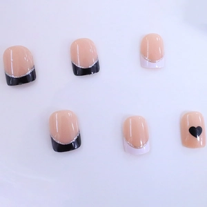 Short square press-on nails with French tip heart design and silver glitter stripes