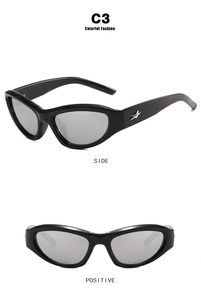 Detail view of black cat-eye Y2K sunglasses with silver star hardware and reflective lenses