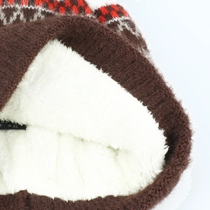 Detail of warm brown knit hat featuring plush sherpa fleece lining and geometric pattern