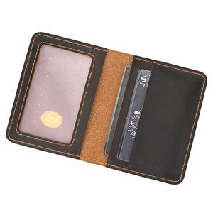 Detail shot of brown crazy horse leather wallet with open card slots and ID window