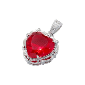Detailed view of luxury silver-tone heart pendant with red gem and clear crystals