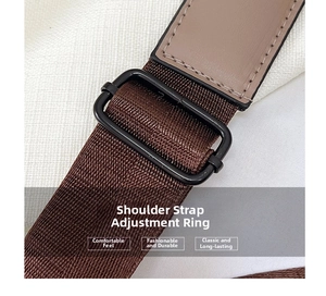 Detail of adjustable nylon shoulder strap with matte metal buckle and leather stitching