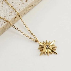 18K gold plated stainless steel starburst pendant necklace with sparkling crystal stone