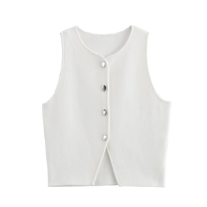 Detail of white knitted vest top with unique silver metallic buttons and small hem slit
