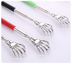 Detail of four telescopic back scratchers with skull hand designs in assorted colors