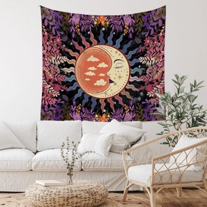 Detail of bohemian sun and moon tapestry in a modern living room setting