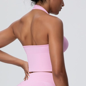 Pink seamless halter neck sports bra and yoga leggings set with ribbed texture