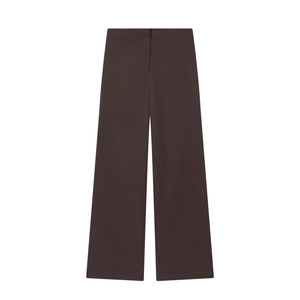 Detailed view of high-waisted dark brown wide-leg trousers in smooth suit fabric texture