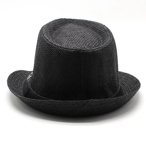 Close-up of black straw fedora hat texture and matching fabric decorative band details