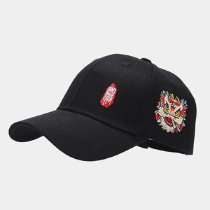 Close-up of vibrant lion dance embroidery and Chinese script on black baseball cap