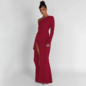 Detail of burgundy one-shoulder long sleeve dress with waist ruching and high slit