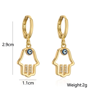 Detail of 18K gold-plated Hamsa earrings with blue evil eye and zircons, 2.9cm in height
