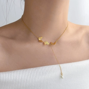Double-layered butterfly pearl tassel choker necklace in gold for elegant women