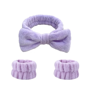 Three-piece purple plush set including bow headband and wristbands for washing face