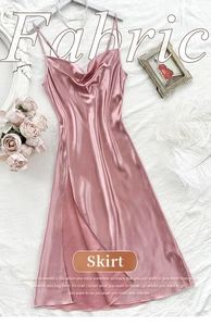 Detail of pink satin sleepwear featuring a cowl neck and smooth silk texture finish