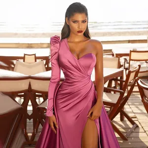 Detail of dusty rose satin evening dress featuring one-shoulder long sleeve and high slit