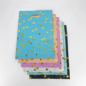 Polka dot birthday gift bags with cut-out handles in six assorted pastel colors