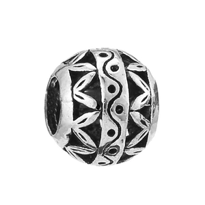 Close-up of retro hollow silver bead with carved petal patterns for DIY jewelry making