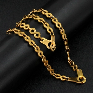 Detail of 18K gold-plated infinity link chain with durable metal clasp on black background