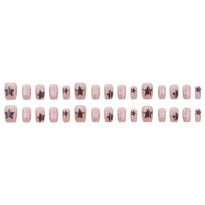 Short square press-on nails in nude pink with star patterns for a minimalist look