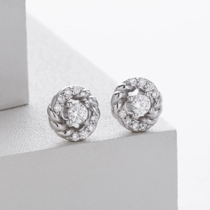 Detail of S925 sterling silver twist earrings with micro-set sparkling white zircons
