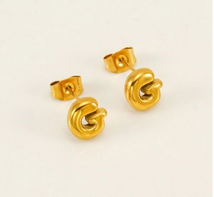 Detail of 18K gold plated stainless steel G-letter bubble stud earrings with high polish