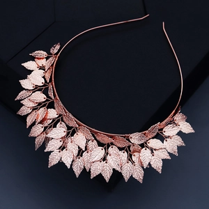 Baroque style bridal headband featuring intricate rose gold metal leaves on a black stand