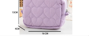 Detailed view of purple heart quilted mini pouch with dimensions 16cm x 13cm x 4cm