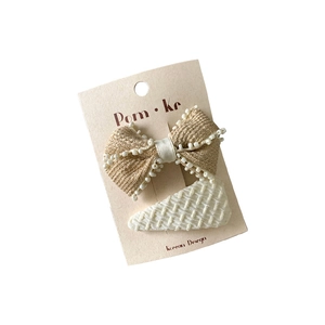 French style lace bow hair clip set with cream fabric and white pearls on a display card