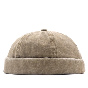 Vintage washed khaki canvas docker hat with brimless dome and folded edge detail