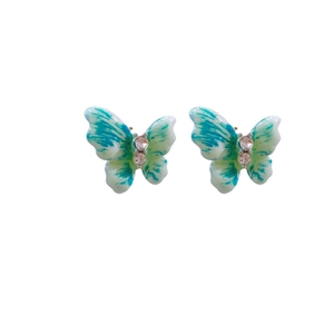 Vintage-style blue and white butterfly stud earrings with rhinestones and gold posts