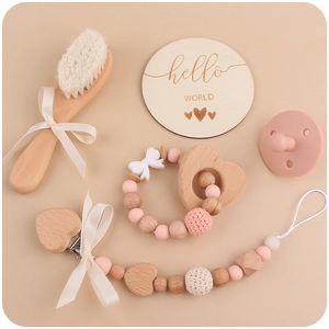 Baby beechwood teether set with pink pacifier chain and hello world milestone card