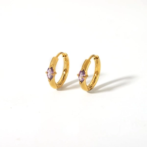 Detail shot of 18K gold-plated earring with marquise-cut purple zircon in four-prong setting