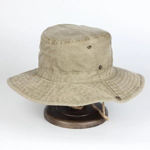Detailed close-up of khaki washed canvas sun hat with metal eyelets and chin strap
