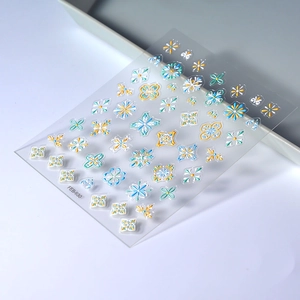 Detail showing FEB-630 3D embossed nail stickers with blue and white tile patterns