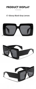 Detailed view of glossy black square sunglasses with dark grey lenses in C1 colorway