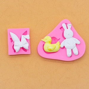 Stampi in silicone rosa per decorazioni di torte con coniglietto, papera e fiocco a cartone