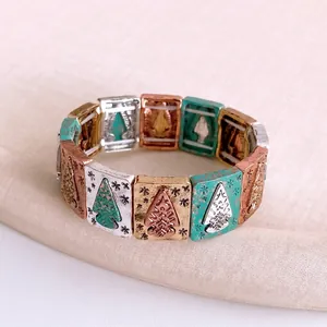Vintage elastic bracelet with rectangular metal links and embossed pine tree motifs