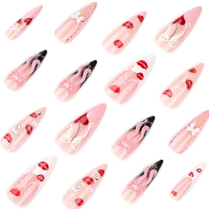 Pink stiletto press-on nails with sweet bowknots, lip prints and heart patterns