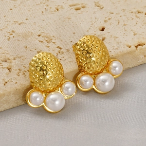Unique gold stainless steel octopus-style earrings featuring textured metal and pearls