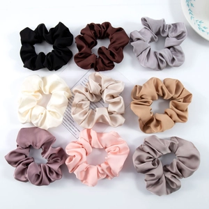 Set of 9 large satin silk scrunchies in neutral colors arranged in a 3x3 flat lay grid