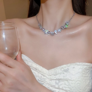 Close-up of sparkling zircon flower necklace on model with elegant palace style