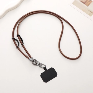 Close-up of brown PU leather phone lanyard with black connector pad and metal buckle