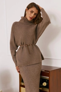 Detail of a brown knit sweater set with high collar and thin leather belt accessory