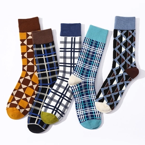 Five pairs of vintage plaid cotton crew socks for men in assorted colors and patterns