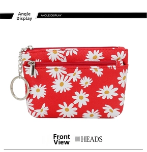 Detail of red daisy print coin purse with double zipper compartments and a key ring